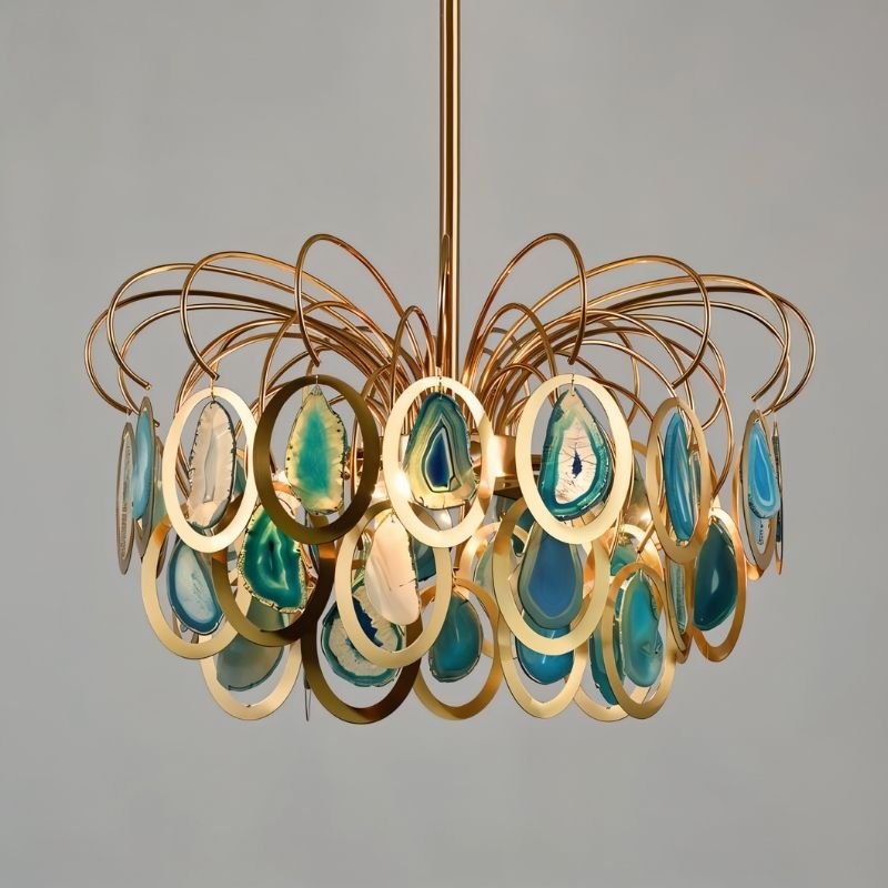 "A gold chandelier with an intricate iron frame and handcrafted agate stone accents."