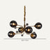 A modern chandelier with a gold finish and six smoky glass bulbs, measuring 28.3 inches wide.