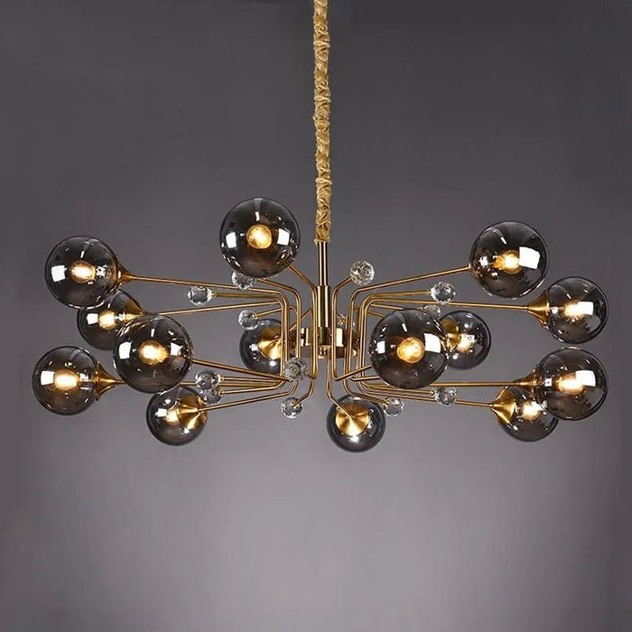 Create a mesmerizing ambiance with the soft radiance of the Ajnur Chandelier.