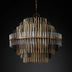 Round chandelier featuring metallic rods and glass accents, ideal for modern decor. Dimensions not specified.