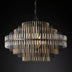 Round chandelier featuring vertical metal rods in gold and black finishes, showcasing a modern design and elegant style.