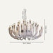 Enhance the ambiance of your living space with the Ardere Indoor Chandelier, its timeless beauty and captivating design making it a centerpiece of elegance in your home.