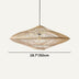 Natural woven rattan pendant light with diamond shape suspended against white background.