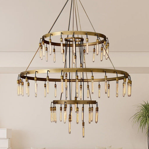 The Betsy Chandelier exudes vintage charm with its intricate wrought iron design and delicate crystal accents, adding a touch of elegance to any room.