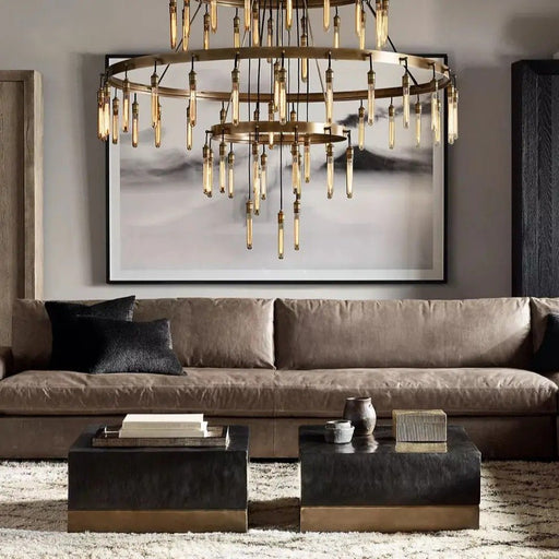 Featuring graceful curves and antique brass finish, the Betsy Chandelier brings a timeless allure to your living space, illuminating it with warmth and style.