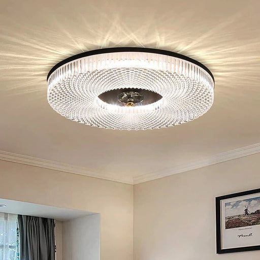 The Blaca Ceiling Light boasts a sleek and modern design, featuring a circular frame with integrated LED panels that emit a soft and diffused glow, illuminating your space with style and sophistication.