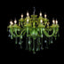 Green crystal chandelier with multiple candle-style lights and hanging crystals, photographed against a black background.