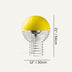 Yellow dome table lamp with wire base cage design, shown against neutral background.