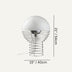 Modern table lamp with frosted glass dome and metal spiral cage base on neutral background.