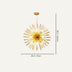 Gold starburst chandelier with spiky metal rods on cream background.