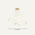 Modern gold pendant chandelier with orbital rings and suspended strings against a neutral background.