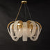 Pendant chandelier with brass finish and draped pearl beaded shade against dark background.