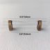 Brass and frosted acrylic bar pull with measurements of 5.5 inches length and 3.8 inches width displayed on white background.