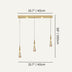 Three-pendant linear chandelier with brass canopy and frosted glass teardrop shades on white background.