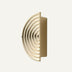 Cream-colored concentric arc wall sconce with modern curved design on neutral background.