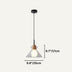 Pendant light with geometric gray shade and wood accent, suspended from black cord against neutral background.