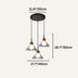 Three-light pendant fixture with black canopy and brushed brass accents featuring geometric glass shades on white background.