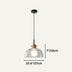 Clear glass dome pendant light with wood accent and black cord against neutral background.