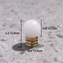 White crystal sphere knob with brass base displayed on textured gray surface with dimensions labeled.