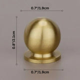 Leather brass cabinet knob Suro Knob Open Box with round gold finish, measuring 0.8 inches tall and 0.7 inches wide. Ideal for stylish furniture upgrades.
