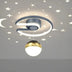 Modern ceiling light fixture with curved silver metal arms, suspended gold and white spherical pendant, against starry night sky background.