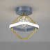 Modern ceiling light with brass square frame, white curved accent band, and LED bulb against white ceiling.