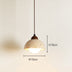 Travertine pendant light with cream dome shade and bronze hardware, dimensions marked as 15cm diameter and 18cm height.