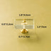 Clear glass and brass drawer pull with measurements displayed on cream background.