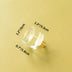 Clear glass cylindrical knob with brass base shown against a yellow background with dimensions labeled.